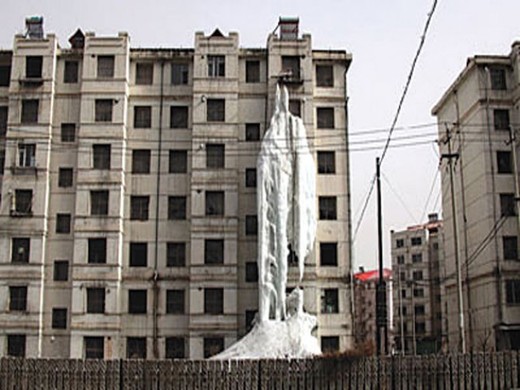 Running Tap Results In A Spectacular Frozen Waterfall In China